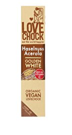 Der Riegel Golden White Haselnuss Acerola von Lovechock vereint knackig-nussige, vegane weiße Schokolade mit der feinen Säure aus Acerolakirschen.