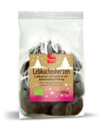 Die mit schwarzer Johannisbeere gefüllten Lebkuchenherzen von Linea Natura sind mit aromatischer Zartbitterschokolade überzogen.