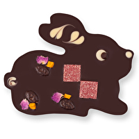 Dieser vegane Schokohase ist ein besonders hübsches Exemplar. Der Hasi mit dunkler Schokolade und Nougat Deluxe von Zotter besteht aus zartschmelzender dunkler Schokolade mit 70% Kakaoanteil und ist mit zart schmelzendem Nougat gefüllt.