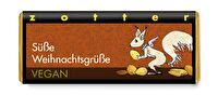 Die Süße Weihnachtsgrüße Schokolade von Zotter ist eine vegane Schokolade mit 70% Kakaoanteil und jeder Menge Haselnüsse. Haselnussnougat, gerösteten Haselnüssen und mit Mandelkrokant, Zimt sowie Vanille verfeinert. Lecker!