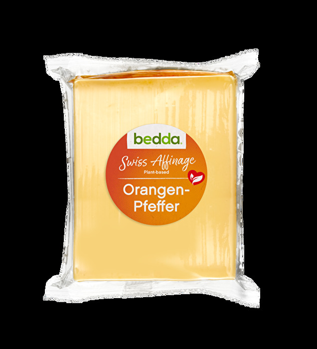 Der Swiss Affinage Orangen-Pfeffer Blöckli von bedda ist eine pflanzliche Käsealternative, der nach einem speziellen, schweizerischen Verfahren hergestellt und veredelt wurde.
